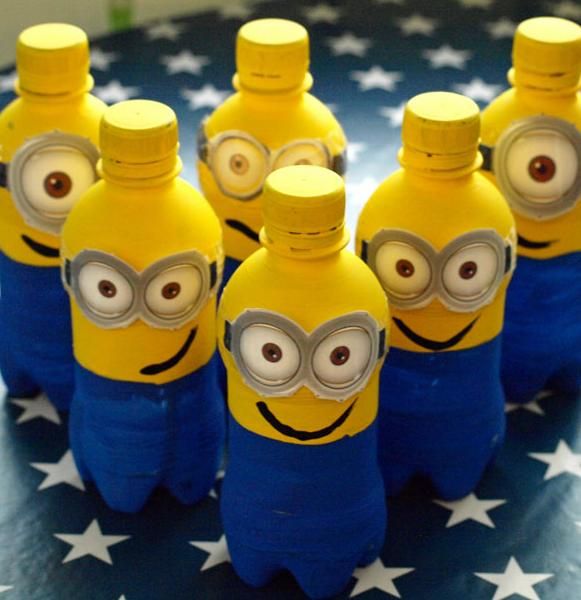 six yellow and blue minion bottles sitting on top of an american flag tablecloth