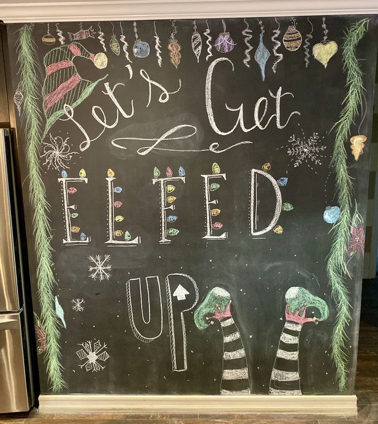 a chalk board with the words let's get elfed up written on it