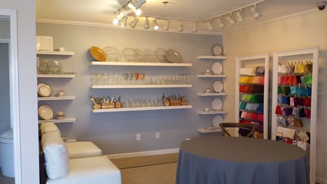 the room is clean and ready to be used as a craft shop or sewing studio