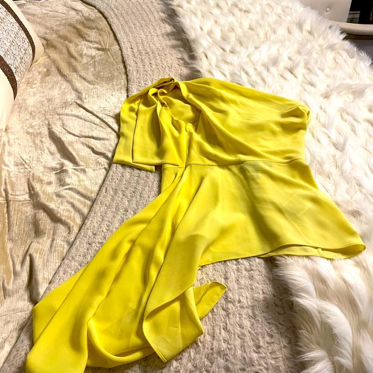 Bright Yellow Bcbg One Shoulder Top. Size Extra Small. Includes A Side Zipper . The Fabric Is Light And Flows Nicely . New In Perfect Condition. I Only Wore It Once For My B Day. It’s Dry Cleaned And Beautiful . Not A Blemish On It. So Are You Ready For A Night Out? Chic Yellow One-shoulder Top, One-shoulder Silk Top For Spring, Spring Silk Top With Asymmetrical Neckline, Fitted Asymmetrical Silk Top, Fitted Silk Asymmetrical Top, Silk Top With Asymmetrical Neckline For Spring, Asymmetrical Silk Top For Party, Chic Draped Spring Blouse, Chic Draped Blouse For Spring