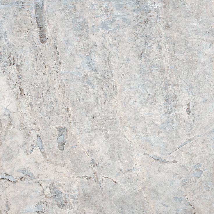 a white marble textured surface with grey veinies