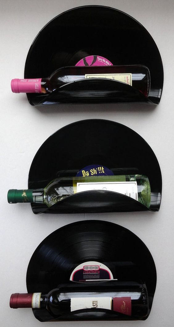 two black records with wine bottles on them