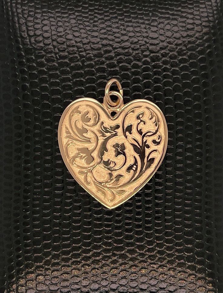 14kt solid gold heart is exceptionally detailed, made from a hand engraved model. Measuring 29mm by 24mm ( without ring). A future heirloom. 6.7g. Money back guarantee within 14days. Buyer pays return shipping and must be returned in original condition with box and no alterations. Antique Heart-shaped Yellow Gold Jewelry, Classic Double Heart Engraved Jewelry, Elegant Etched Heart Pendant Jewelry, Classic Engraved Double Heart Jewelry, Antique Heart-shaped Jewelry For Formal Occasions, Antique Heart Shaped Jewelry For Formal Occasions, Antique Heart Jewelry For Formal Occasions, Heirloom Heart-shaped Jewelry With Intricate Design, Collectible 14k Gold Heart-shaped Jewelry