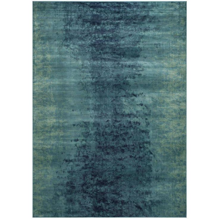 an area rug with blue and green tones