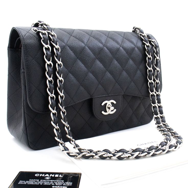 Brand: Chanel Model: Double flap Color: Black Material: Leather Inclusions: Authenticity card, Dust bag, Box, Care booklet Dimensions: W 30 H 20 D 9.1 cm Serial number: 18303006 Country of origin: Italie Condition: AB - good condition. This genuine Chanel Large Grained Calfskin Double Flap Chain Shoulder Bag boasts an elegant black hue and is impeccably crafted from grained calfskin, often referred to as Caviar Leather, signifying its contemporary style likely originating from the year 2013. The Chanel Double Flap, Chanel Model, Chain Shoulder Bag, Quilted Leather, Prada Bag, Dior Bag, Chain Strap, Chanel Bag, Gucci Bag