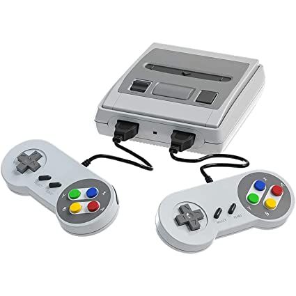 two video game controllers sitting next to each other on top of a white surface,