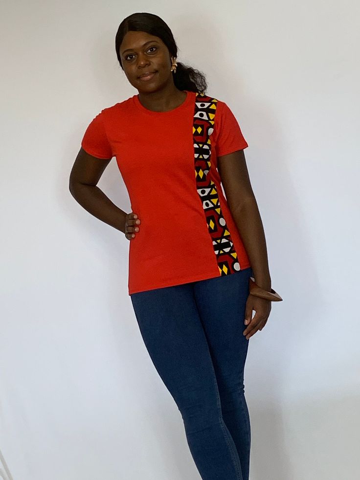 Red T shirt in an African print available in small medium and large. Fitted Red Crew Neck Top, Red Printed Crew Neck Top, Red Crew Neck Printed Top, Red Cotton Shirt With Graphic Print, Red Crew Neck Top With Print, Red Fitted Cotton Tops, Red Printed Short Sleeve Top, Fitted Red Cotton Tops, Red Printed Cotton T-shirt