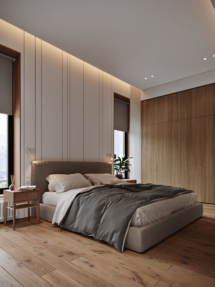 a large bed sitting in the middle of a bedroom next to a tall wooden wall