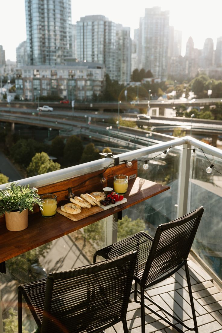 two chairs and a table with food on it