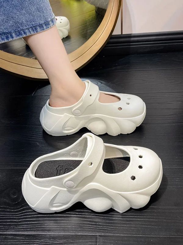 Hollow Crocs Sandals Casual White Closed Toe Jelly Sandals, White Trendy Slip-on Jelly Sandals, White Closed Toe Jelly Sandals For Summer, Casual Synthetic Jelly Sandals With Round Toe, Casual Jelly Sandals With Round Toe, White Non-slip Flat Jelly Sandals, White Eva Sandals With Round Toe, White Closed Toe Synthetic Jelly Sandals, Casual Round Toe Jelly Sandals