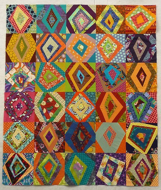 an image of a colorful quilt on display