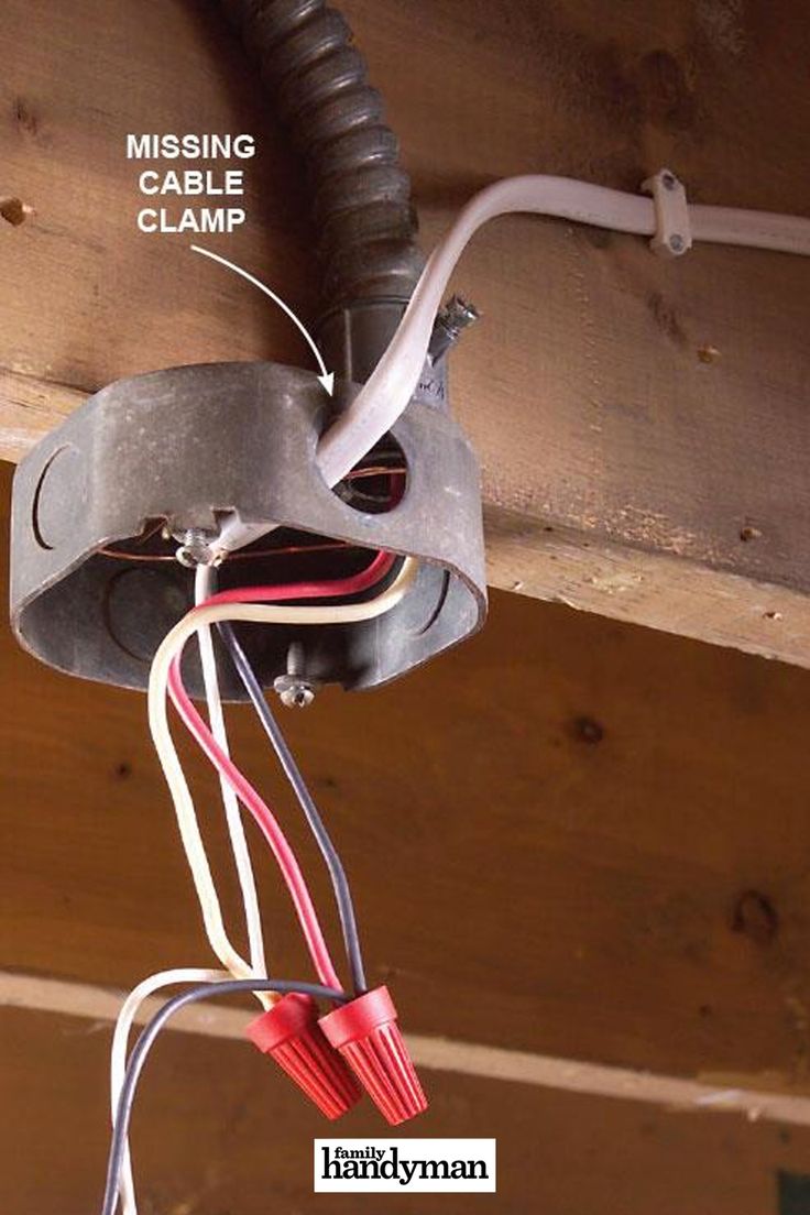 an electrical outlet is connected to the ceiling with wires that are plugged into it