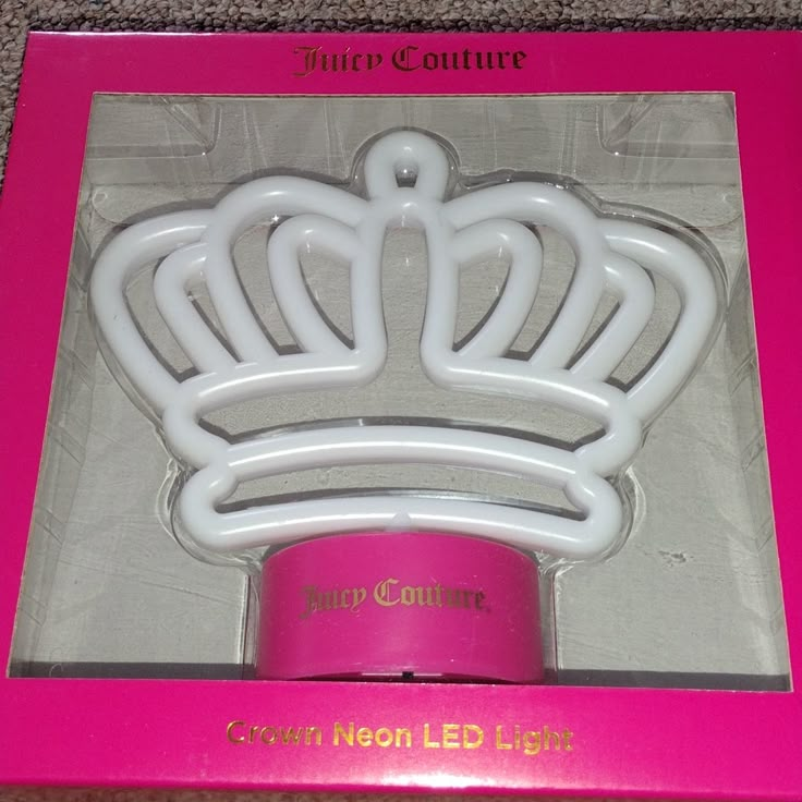 a pink box with a white crown in it