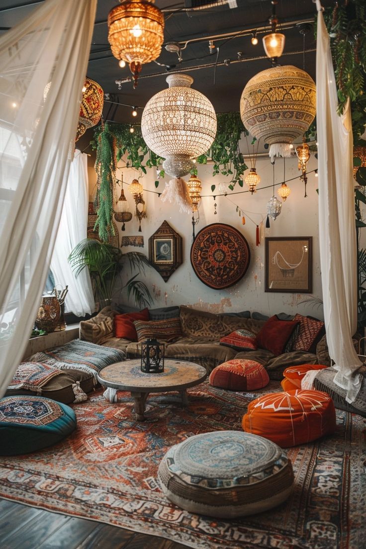 a living room filled with lots of furniture and hanging lights