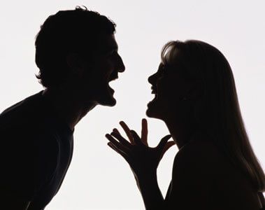 the silhouette of a man and woman kissing each other in front of a white background