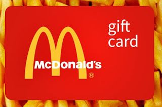 a mcdonald's gift card surrounded by french fries