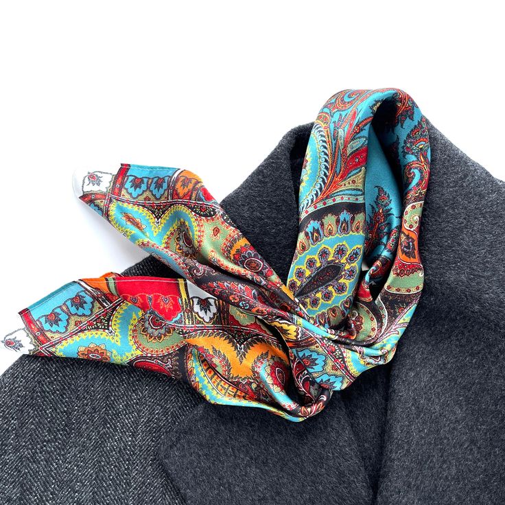 Introducing our exquisite Bohemian Style Print Silk Square Scarf—a timeless accessory that exudes charm and allure. Crafted from the finest quality silk, this scarf features an enchanting bohemian-inspired print, adorned with vibrant colours and intricate patterns. Versatile, chic, and comfortable, it offers endless styling possibilities—whether worn as a refined neckerchief, a bandana, or a stylish hair scarf. Benefits of Wearing Silk Hypoallergenic Properties: Silk's natural hypoallergenic nat Classic Multicolor Silk Scarf For Formal Occasions, Elegant Multicolor Wedding Scarves, Elegant Multicolor Wedding Scarf, Elegant Multicolor Pocket Square, Classic Multicolor Scarves For Gifts, Elegant Multicolor Silk Scarf With Ties, Geometric Patchwork, Scarf For Men, Silk Neck Scarf