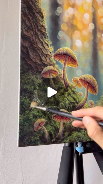 someone is painting mushrooms in the forest