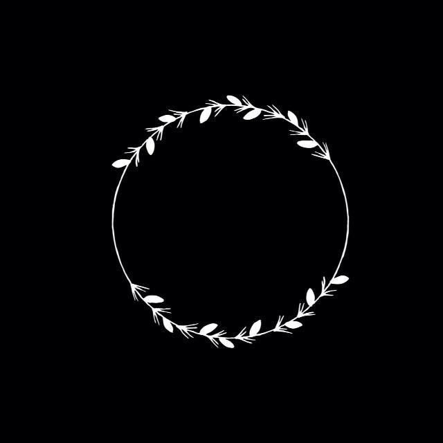 a white circle with leaves in it on a black background