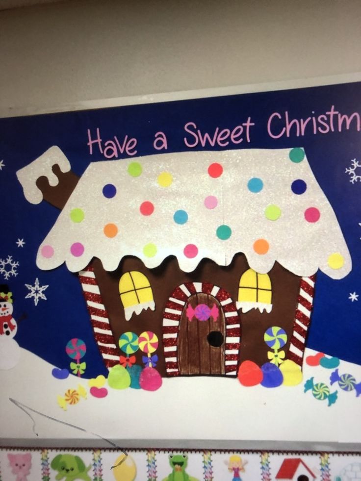 a bulletin board with a gingerbread house on it