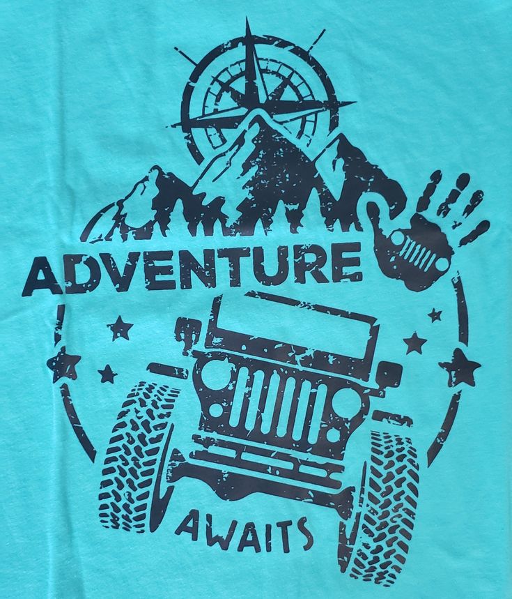 a blue t - shirt with an image of a jeep on it's chest