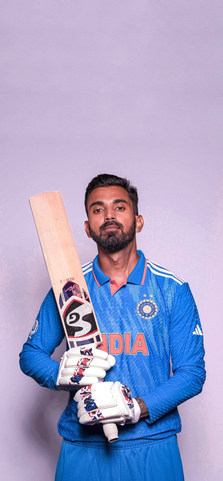 a man holding a cricket bat and ball in front of a purple background with the number 8 on it