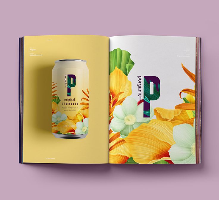 an open book with a beer can on the cover and flowers in the background,