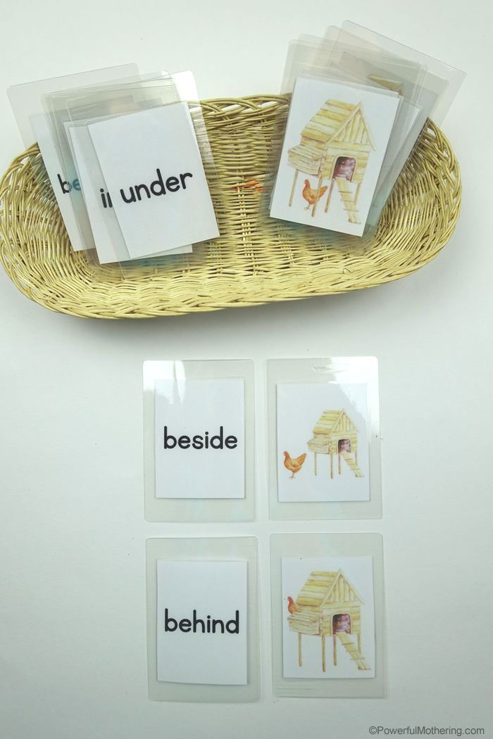 four cards with words on them sitting in a basket