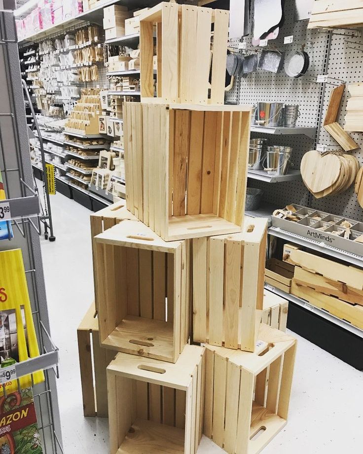 wooden crates stacked on top of each other in a store