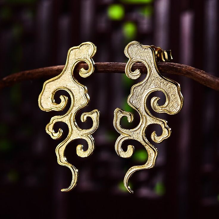 Introducing our Asian Style Cloud Earrings, a harmonious blend of elegance and cultural significance that brings the beauty of Asian aesthetics to your jewelry collection. These earrings are available in your choice of sterling silver or gleaming 14k gold, making them a versatile and timeless accessory. **Product Highlights:** **Intricate Cloud Motif:** - These earrings feature an intricate cloud motif inspired by Asian art and culture. Clouds symbolize good luck, happiness, and the promise of a Vintage Gold Earrings, 18k Gold Earrings, Sterling Silver Dangle Earrings, Unique Handmade Jewelry, Fine Jewelry Collection, Gold Earrings Dangle, Silver Earrings Dangle, Chinese Style, Jewelry Earrings Studs