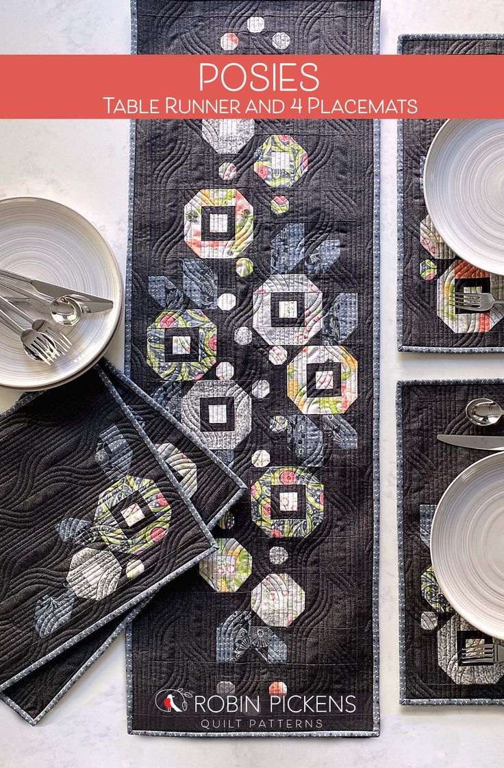 the table runner and placemats are laid out on top of each other with silverware