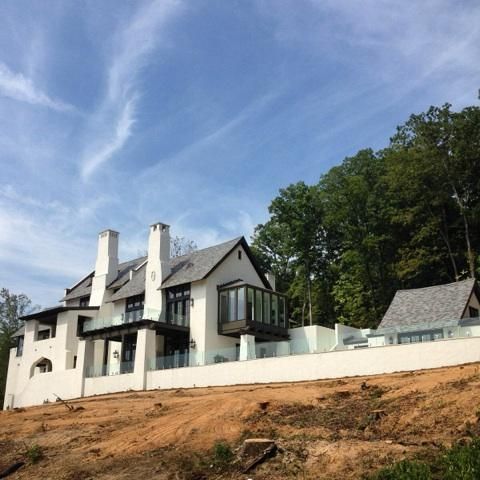 a large white house sitting on top of a hill