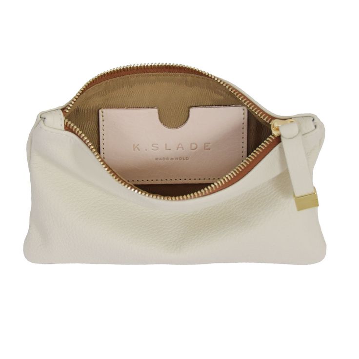 The smaller of our organizational pieces, the Tip Pouch in cream is an easy addition to your travel lineup, and it fits perfectly in our larger handbags. We recommend it for electronic accessories, small cosmetics, jewelry and chargers during travel. Portable White Cosmetic Bag For Travel, White Rectangular Travel Accessories For On-the-go, Versatile Pouch With Interior Card Slots, White Functional Cosmetic Bag With Zipper Pouch, White Functional Cosmetic Bag With Zipper, Functional White Cosmetic Bag With Zipper, Chic Cream Bag With Interior Card Slots, Portable White Pouch For Travel, White Travel Cosmetic Bag With Removable Pouch