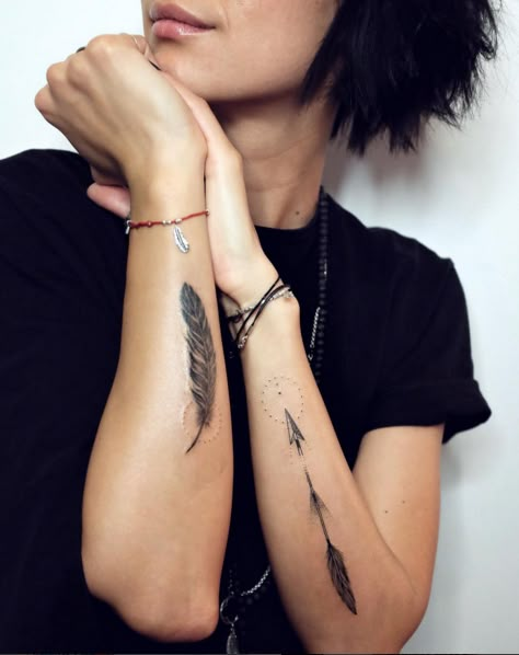 a woman with tattoos on her arms