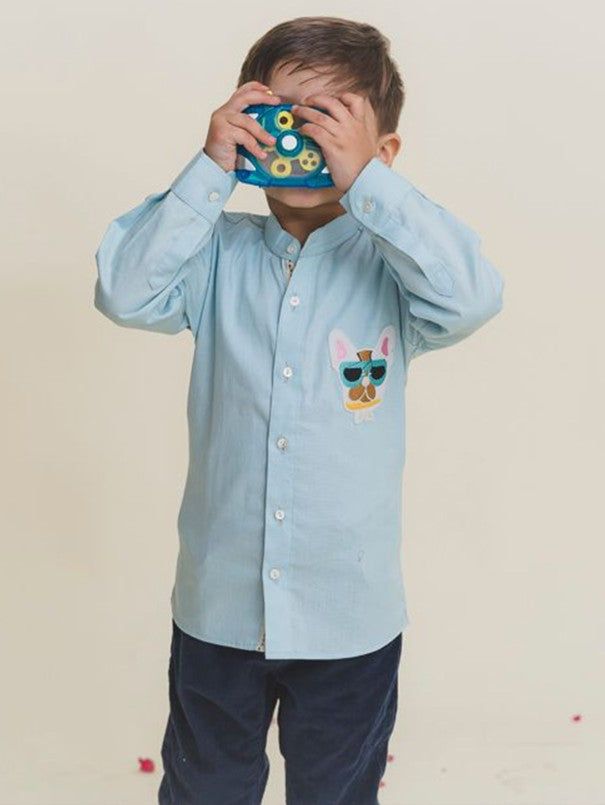 Boys Powder Blue Cotton Shirt By Mr Brat now available at Trendroots Light Blue Long Sleeve Shirt With Pockets, Light Indigo Cotton Button-up Shirt, Embroidered Collared Blue Tops, Light Blue Cotton Embroidered Shirt, Light Blue Embroidered Cotton Shirt, Light Indigo Cotton Collared Shirt, Light Blue Collared Cotton Shirt, Embroidered Cotton Button-up Shirt, Casual Blue Embroidered Shirt