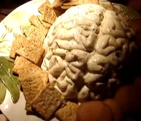 a white plate topped with crackers and a brain