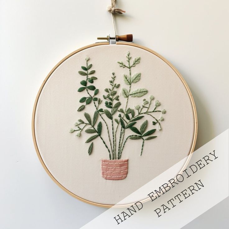 a hand embroidered plant in a pot with the words hand embroidery pattern on it and below