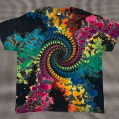 a colorful t - shirt with a spiral design on it