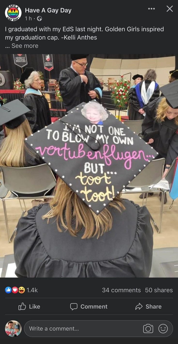 a person wearing a graduation cap with writing on it