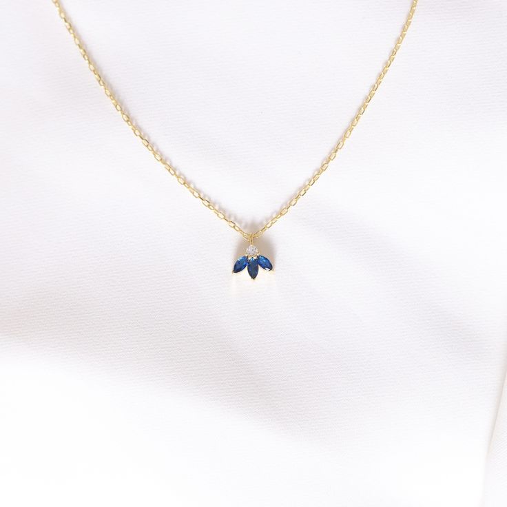 Your Sapphire Flower Pendant is stylish, dainty and pretty ideal for everyday use. Details of solid gold handmade Minimalist Sapphire Jewelry are very eye-catching. It is a great gift for your loved ones. This jewelry will be an indispensable piece of yours. This meaningful September Birthstone Necklace with high quality handwork will be a legacy you can leave to your family its.  * Tiny Sapphire Necklace Details * Material / Gold Kt : Dainty Sapphire Pendant is made of 14k and 18k Solid Gold * Dainty Blue Birthstone Necklace As Gift, Blue Dainty Birthstone Necklace For Anniversary, Dainty Blue Birthstone Necklace For Gift, Blue Dainty Birthstone Necklace For Gift, Dainty Blue Necklace With Delicate Chain, Minimalist Blue Necklace For Anniversary, Dainty Blue Clavicle Chain Necklace, Blue Dainty Necklace With Clavicle Chain, Blue Pendant Necklaces For Birthday