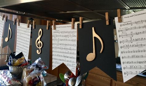 sheet music and musical notes are hung on the wall