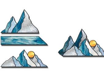 three stained glass mountains with the sun in them