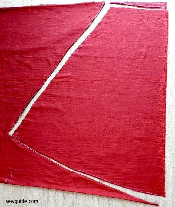 a piece of red fabric with white lines on it