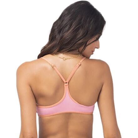 As exciting as sunbathing can be, we'd rather spend our time playing at the beach, so we slip on the Pamela Bikini Top before hitting the road. Its racerback straps and soft, stretchy construction keep us ready for anything in and out of the water. Summer Halter Neck Sports Bra With Built-in Bra, Beach Season Halter Top With Built-in Bra And T-back, Sporty Nylon Swimwear With Removable Bra Pads, Vacation Swimwear With Built-in Bra And Racerback, Vacation Racerback Swimwear With Built-in Bra, Beachwear Swimwear With Removable Bra Pads And T-back, Pink T-back Swimwear With Built-in Bra, T-back Swimwear With Built-in Bra For Sunbathing, Casual Strappy Back Swimwear For Beach