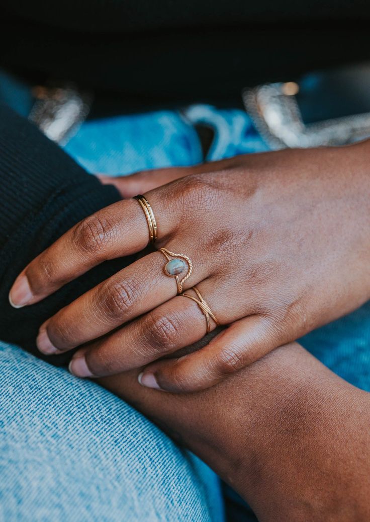 Originally designed to be paired with one of our Gemstone Rings, our Dune Ring stacks beautifully with any Stacking Bands and can hold it's own as a solo ring, too. Twisted wire is hand-shaped and made into a unique stacking ring. Available in 14kt Gold Fill + Sterling Silver. Handmade in Eau Claire, WI. Our jewelry is handmade so each piece will be unique and may vary slightly from what is pictured. Everyday Oval Stackable Jewelry, Adjustable Stackable Promise Jewelry, Stackable Open Ring Jewelry For Promise, Adjustable Oval Opal Ring Minimalist Style, Minimalist Adjustable Oval Opal Ring, Dainty Adjustable Rings For Promise Occasion, Dainty Adjustable Ring For Promise, Adjustable Open Promise Ring, Adjustable Stackable Midi Promise Rings