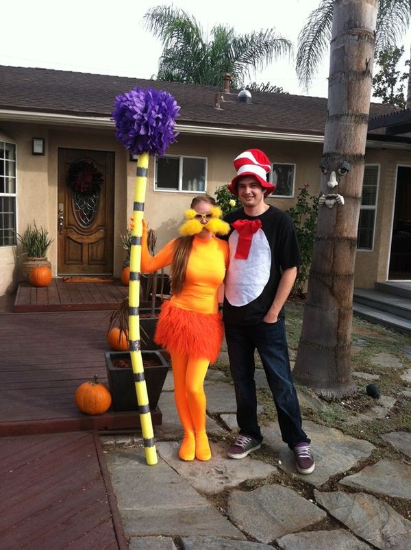 a man and woman dressed up as dr seusster and cat in the hat