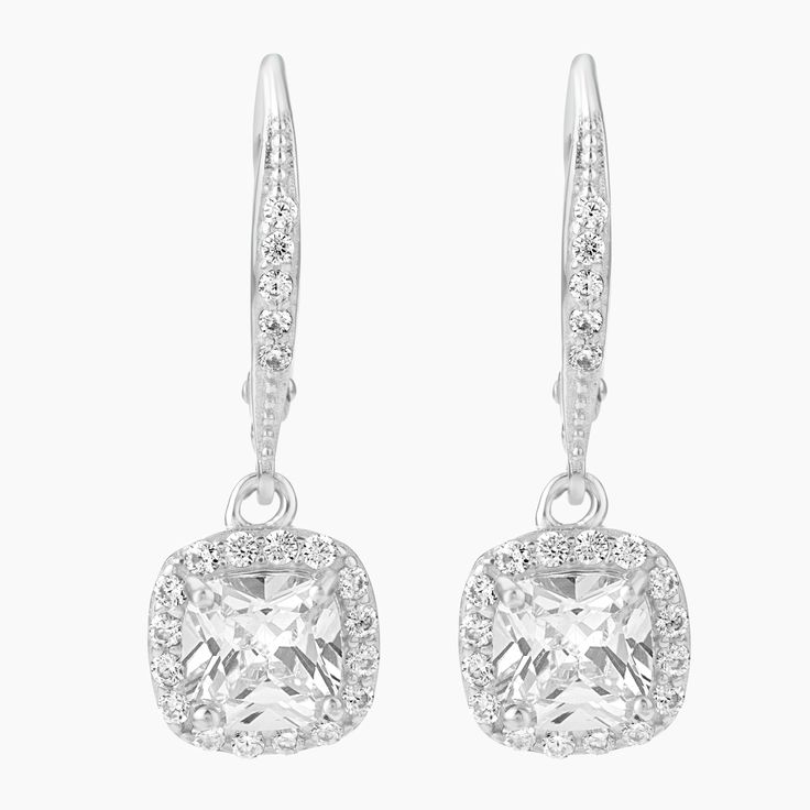 Step into elegance with our exquisite Sterling Silver Cushion Cut Leverback Earrings, featuring a mesmerizing cushion cut clear CZ center stone, surrounded by a halo of sparkling clear cubic zirconia stones. The cushion cut style adds a touch of sophistication and timeless beauty to these earrings, and the secure Leverback closure ensures a comfortable fit. Perfect for any occasion, these earrings will make a statement and elevate your style to the next level. Silver Cushions, Leverback Earrings, Cushion Cut, Cut And Style, Timeless Beauty, Halo, Cubic Zirconia, Comfort Fit, Sparkle