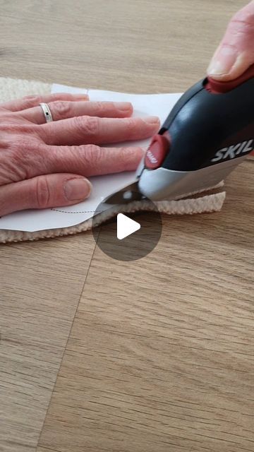 a person using a micro cloth to clean wood floors