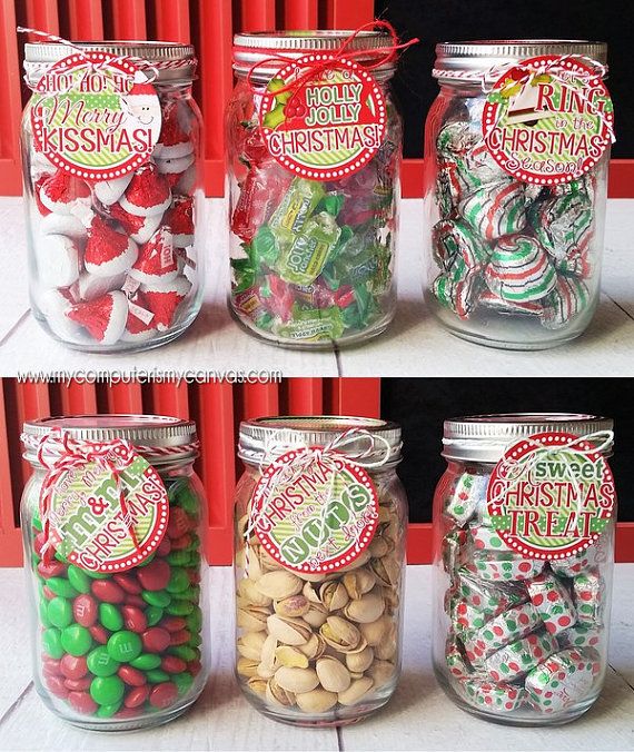 four jars filled with different types of candy