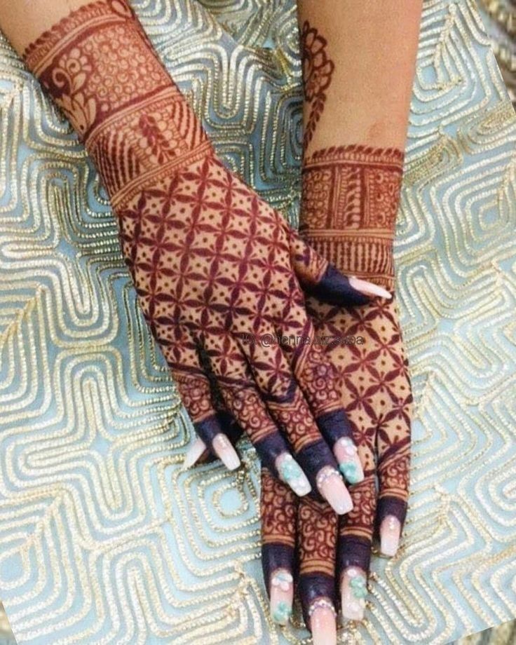 a woman's hands with hennap on it